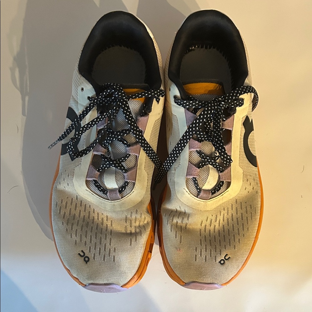 On Running Cream Athletic Shoes with Orange Soles and Pink Details
